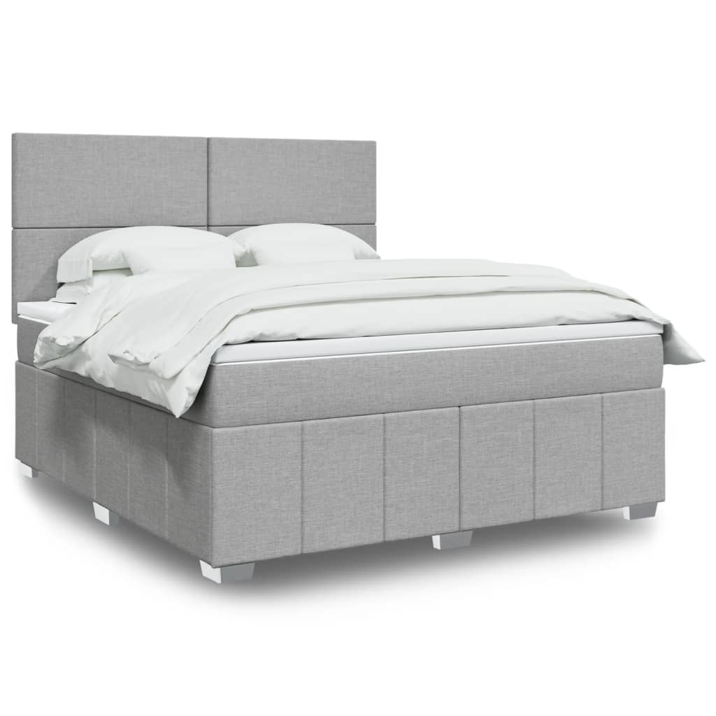 Box spring postelja z vzmetnico svetlo siva 180×200 cm blago