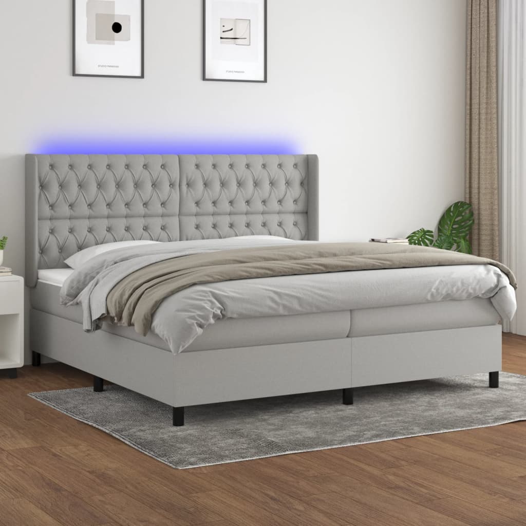 Box spring postelja z vzmetnico LED sv. siva 200×200 cm blago