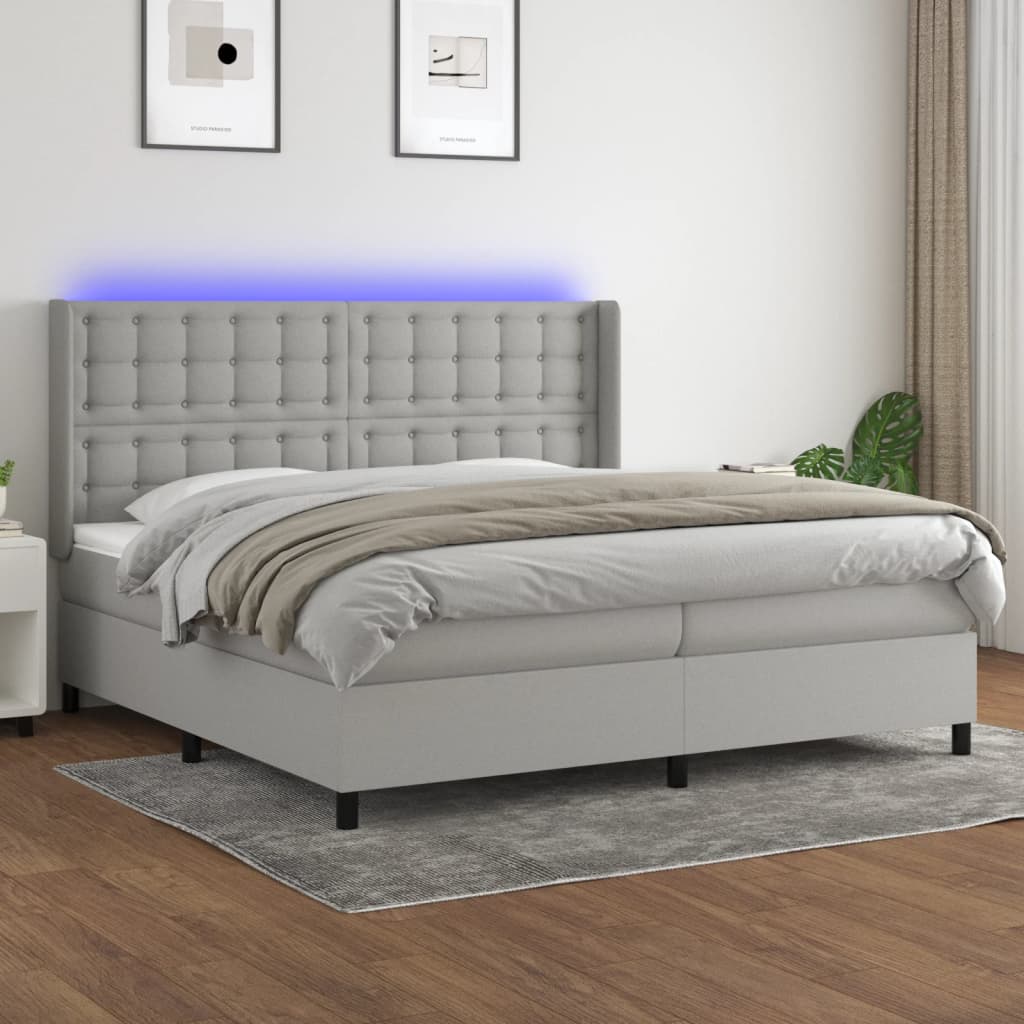 Box spring postelja z vzmetnico LED sv. siva 200×200 cm blago
