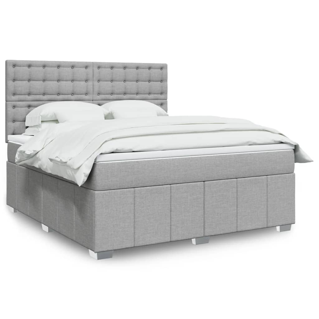 Box spring postelja z vzmetnico svetlo siva 180×200 cm blago