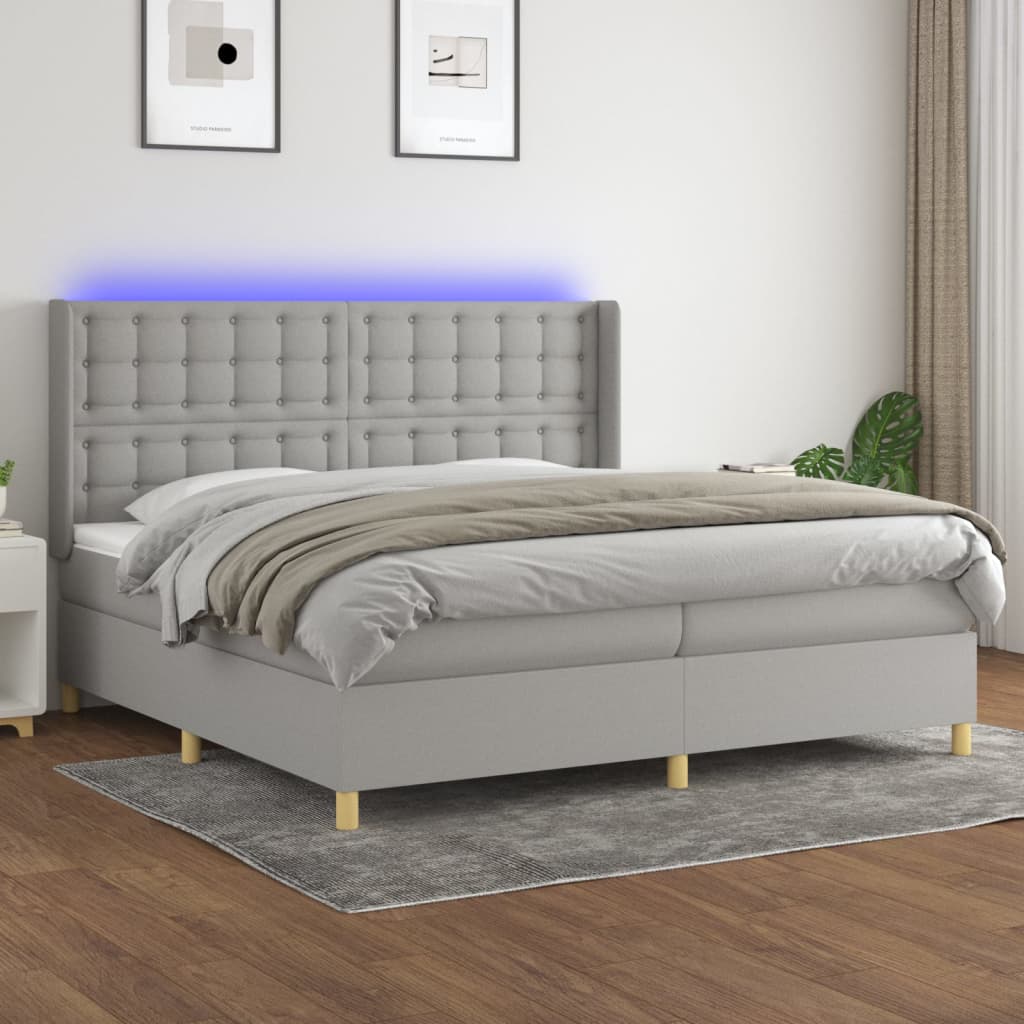 Box spring postelja z vzmetnico LED sv. siva 200×200 cm blago