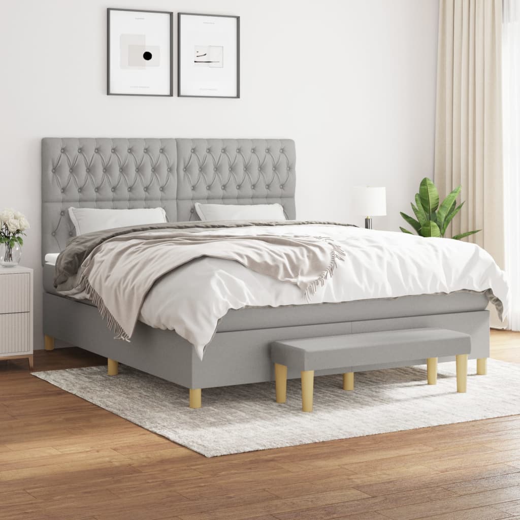 Box spring postelja z vzmetnico svetlo siva 180×200 cm blago